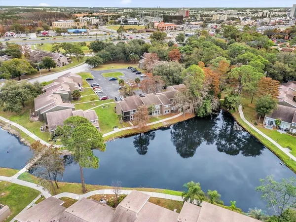 an aerial view of a house with a garden and swimming pool