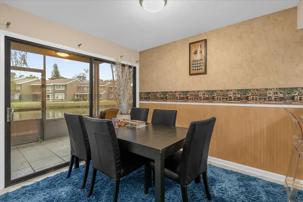 a view of a dining room with furniture window and outside view