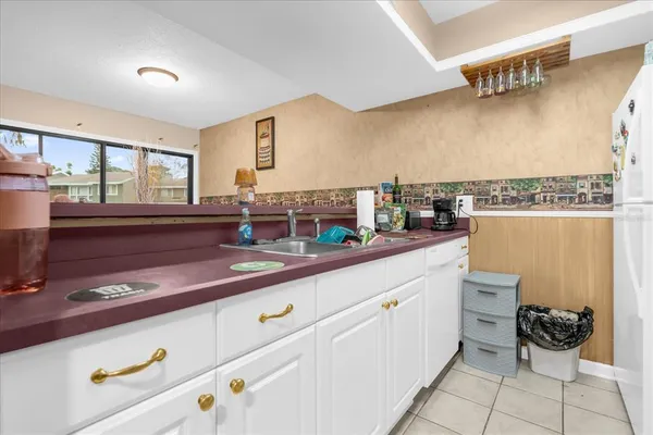 a kitchen with a sink and cabinets