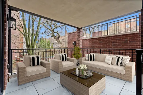 a living room with furniture wooden floor and a table