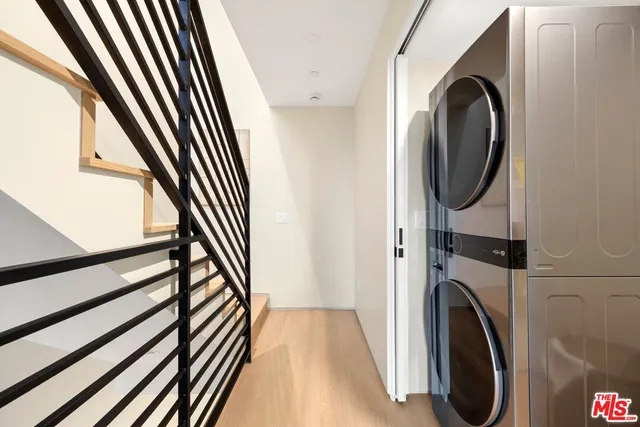 a view of a hallway with washer and dryer