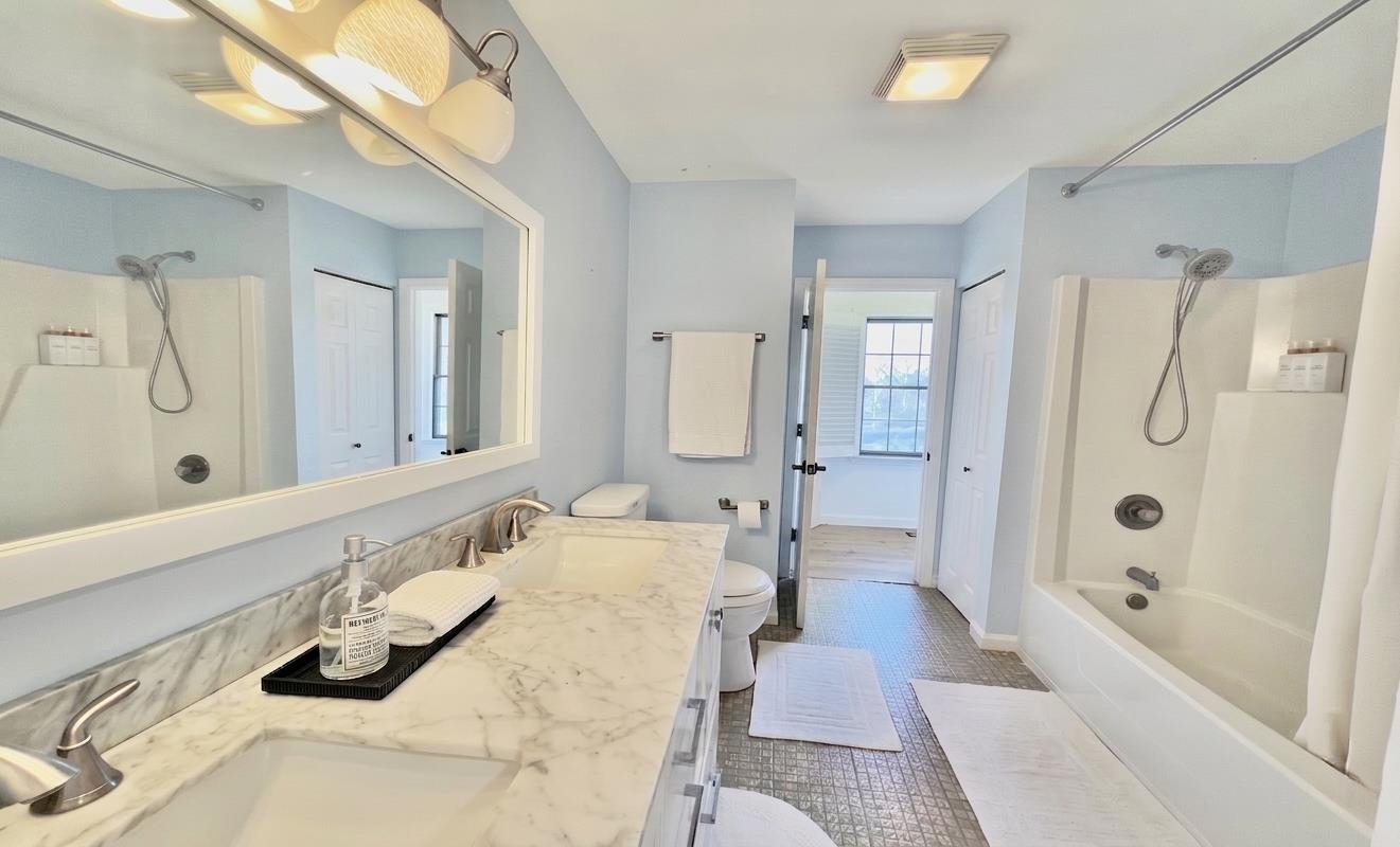 510 Portsmouth Road Cape May, NJ 08204 - Photo 17 of 41 a bathroom with a tub sink and mirror