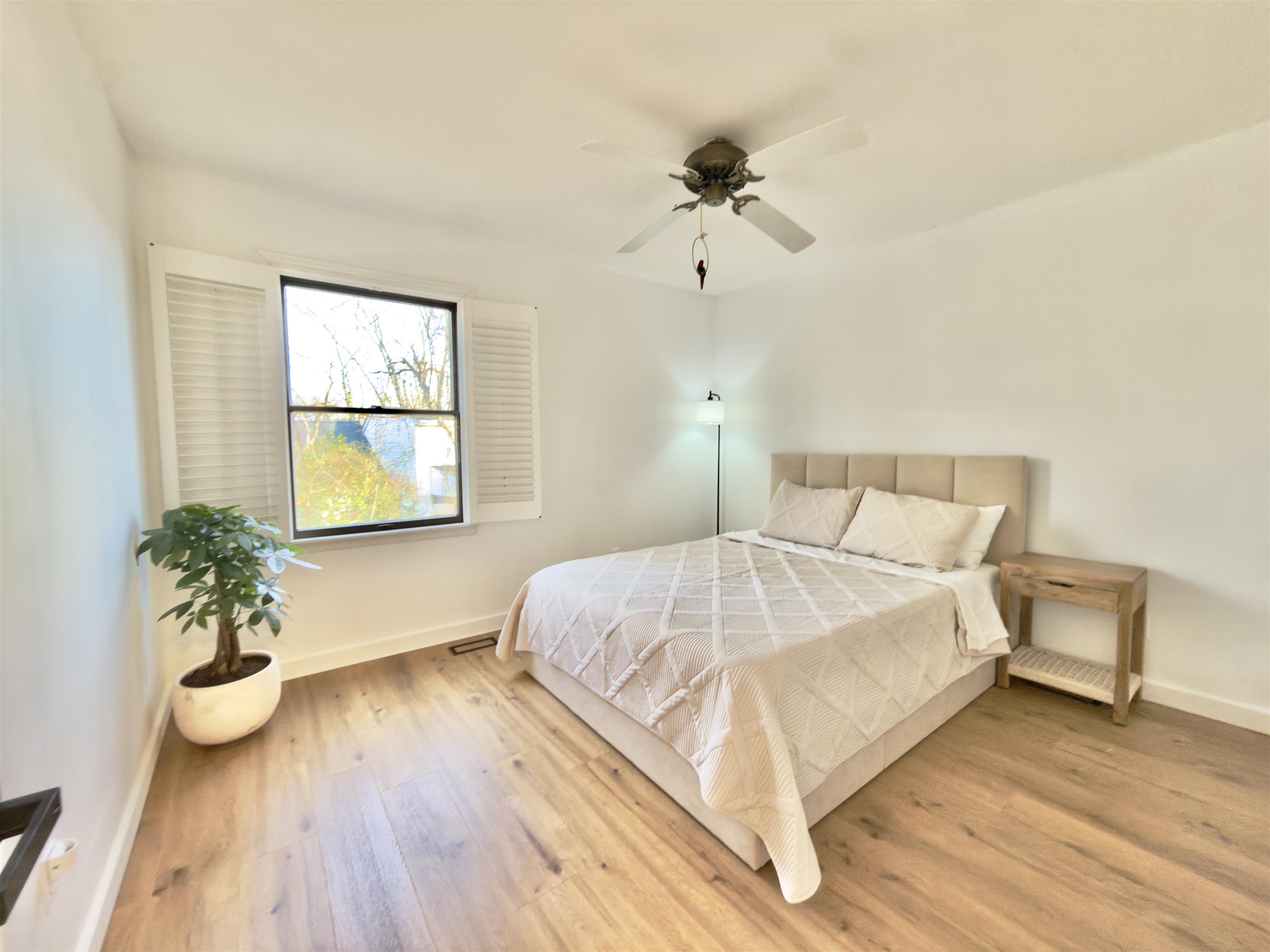 510 Portsmouth Road Cape May, NJ 08204 - Photo 22 of 41 a bedroom with a bed and wooden floor