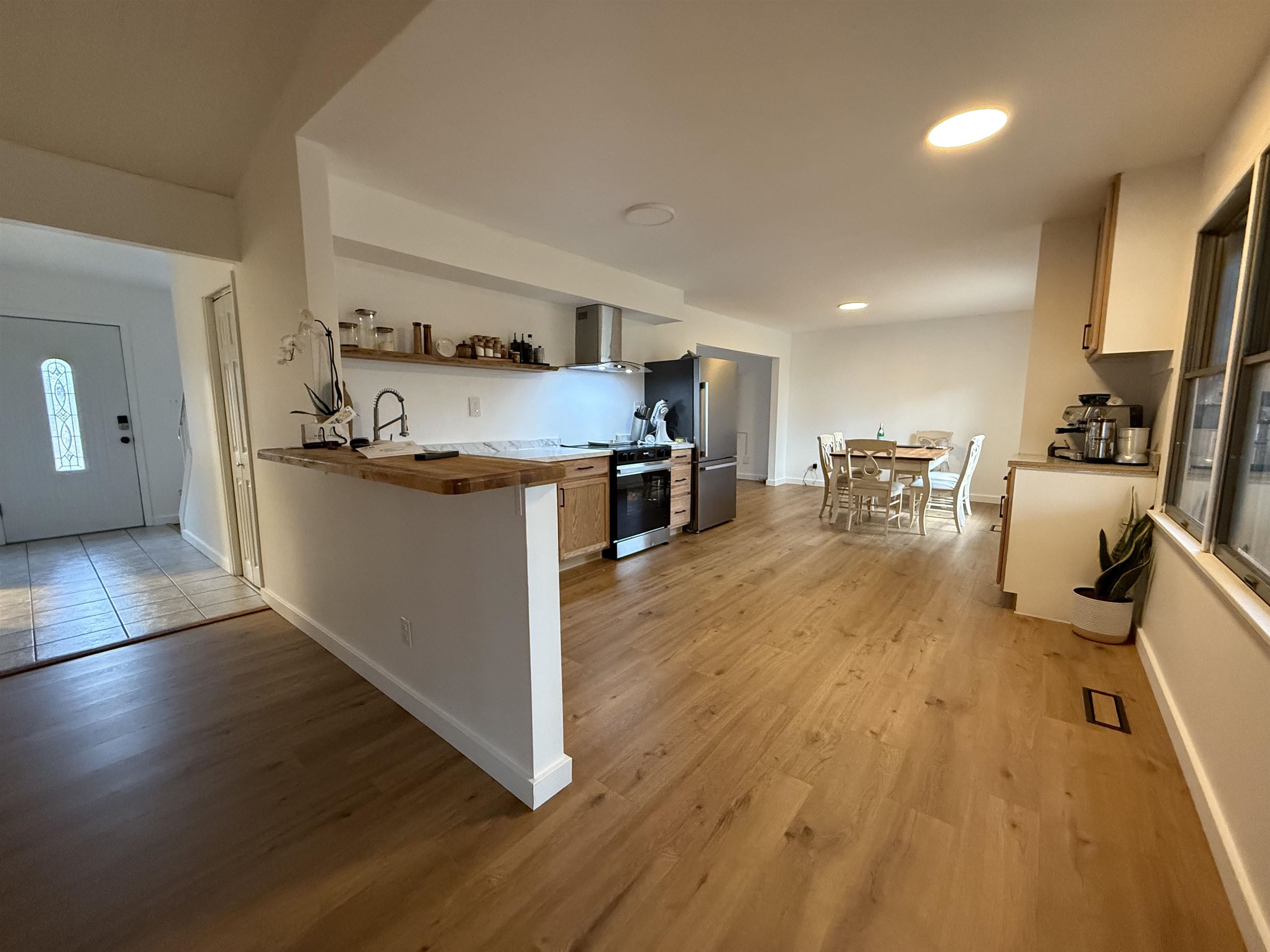 510 Portsmouth Road Cape May, NJ 08204 - Photo 6 of 18 a view of a kitchen with kitchen island a counter top space a sink a stove and wooden floor