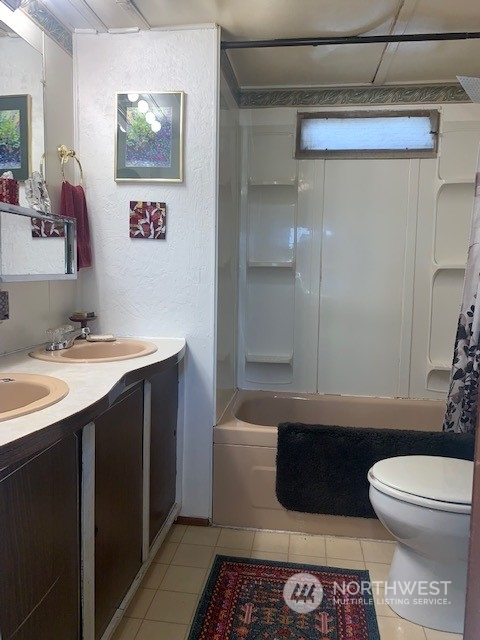 23708 Locust Way, Unit 45 Bothell, WA 98021 - Photo 7 of 13 a bathroom with a sink a toilet and shower