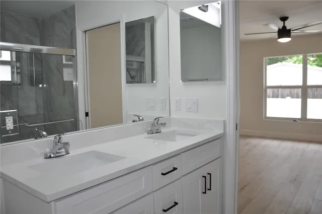 a bathroom with a sink and a mirror