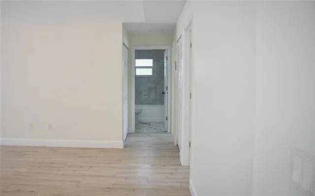 a view of a bathroom from the hallway