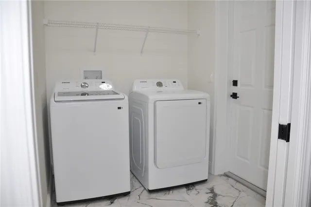 a utility room with dryer and washer
