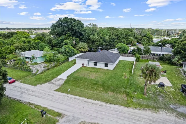 a view of a house with a big yard