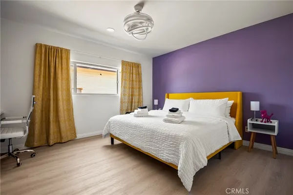 a bedroom with a bed and a table