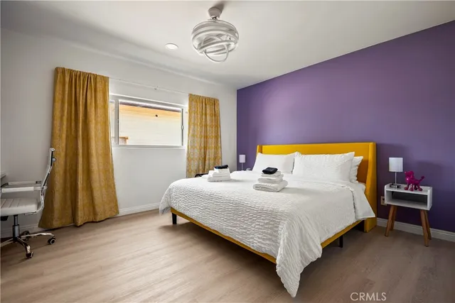 a bedroom with a bed and a table