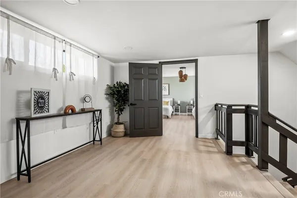 a view of a kitchen with a sink and a refrigerator