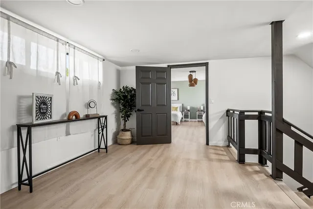a view of a kitchen with a sink and a refrigerator