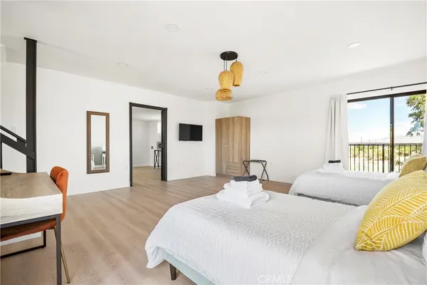 a bedroom with bed and window