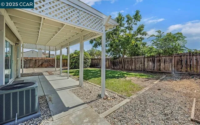 a view of yard with patio