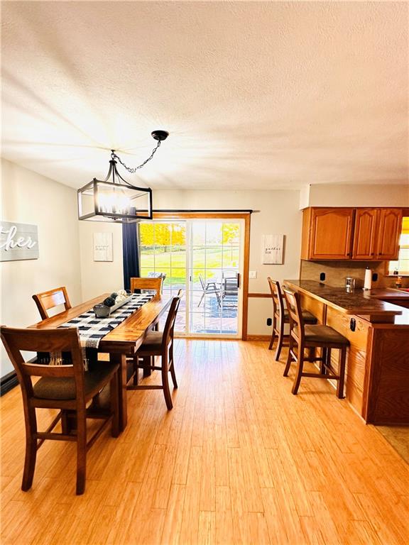 135 Loper Road Hadley, PA 16130 - Photo 24 of 48 a view of a dining room with furniture window and wooden floor