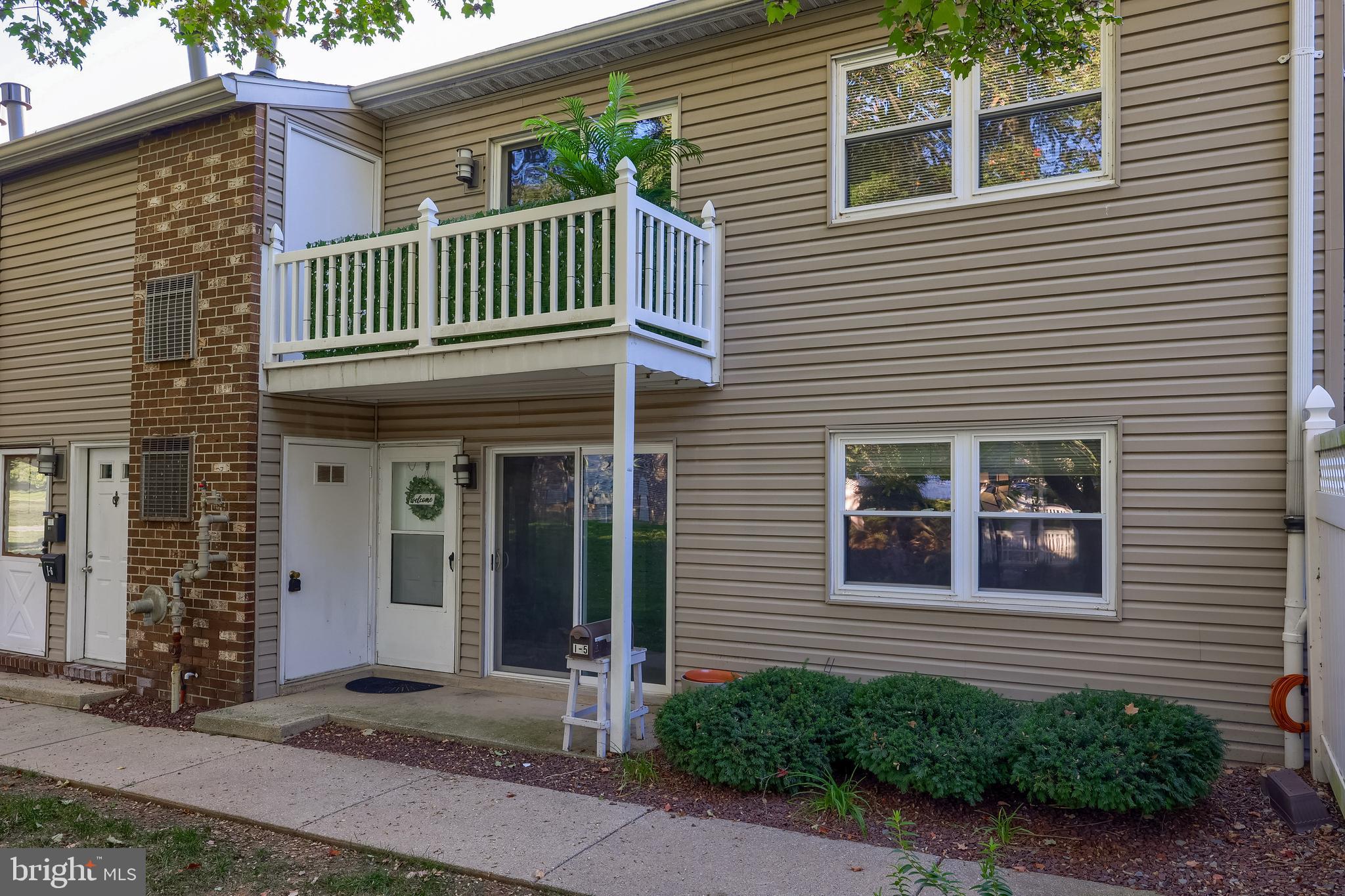 2900 State Hill Road, Unit I5 Reading, PA 19610 - Photo 1 of 26 a view of a house with a small yard and plants