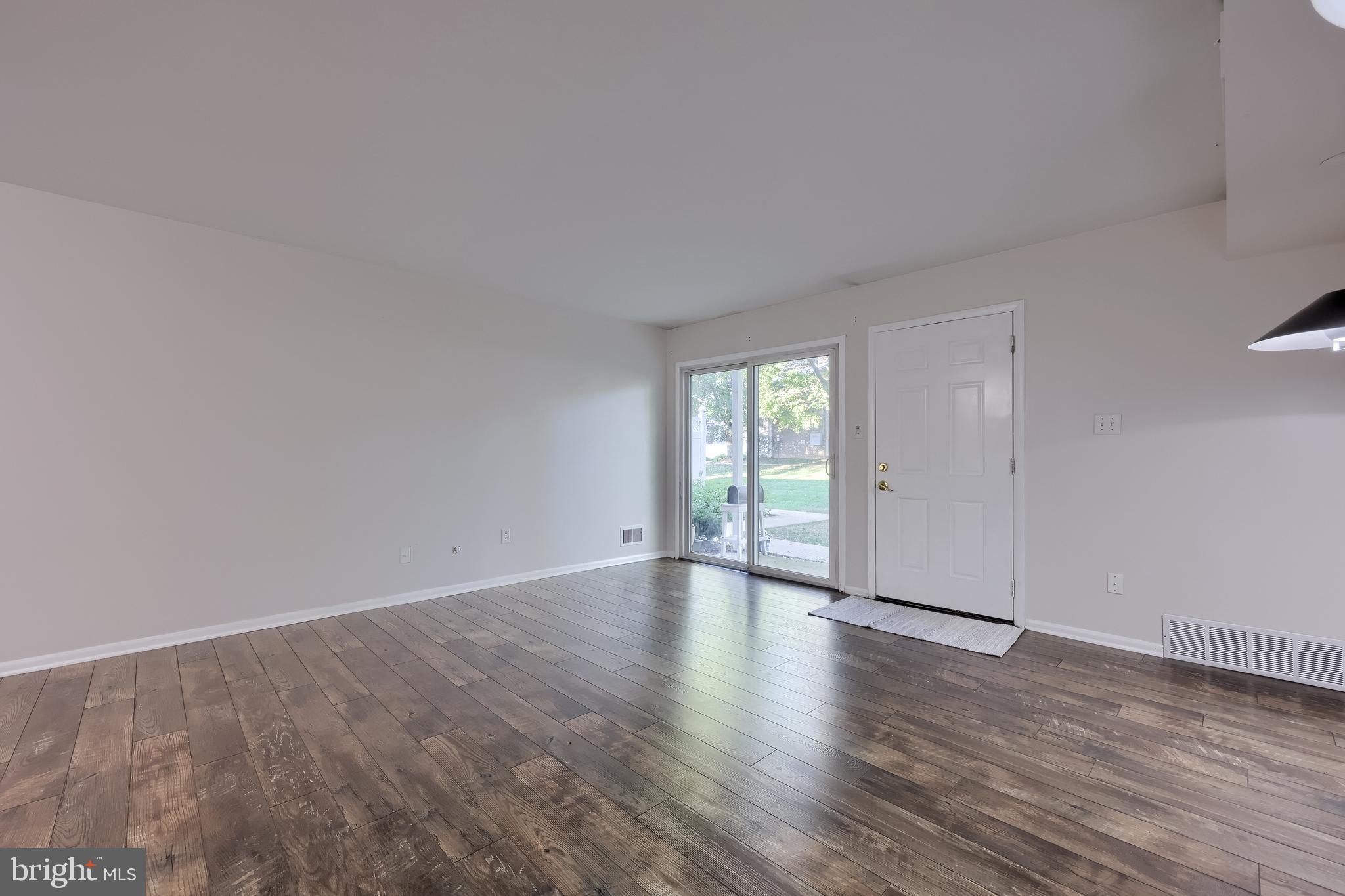 2900 State Hill Road, Unit I5 Reading, PA 19610 - Photo 4 of 26 a view of an empty room with wooden floor and a window
