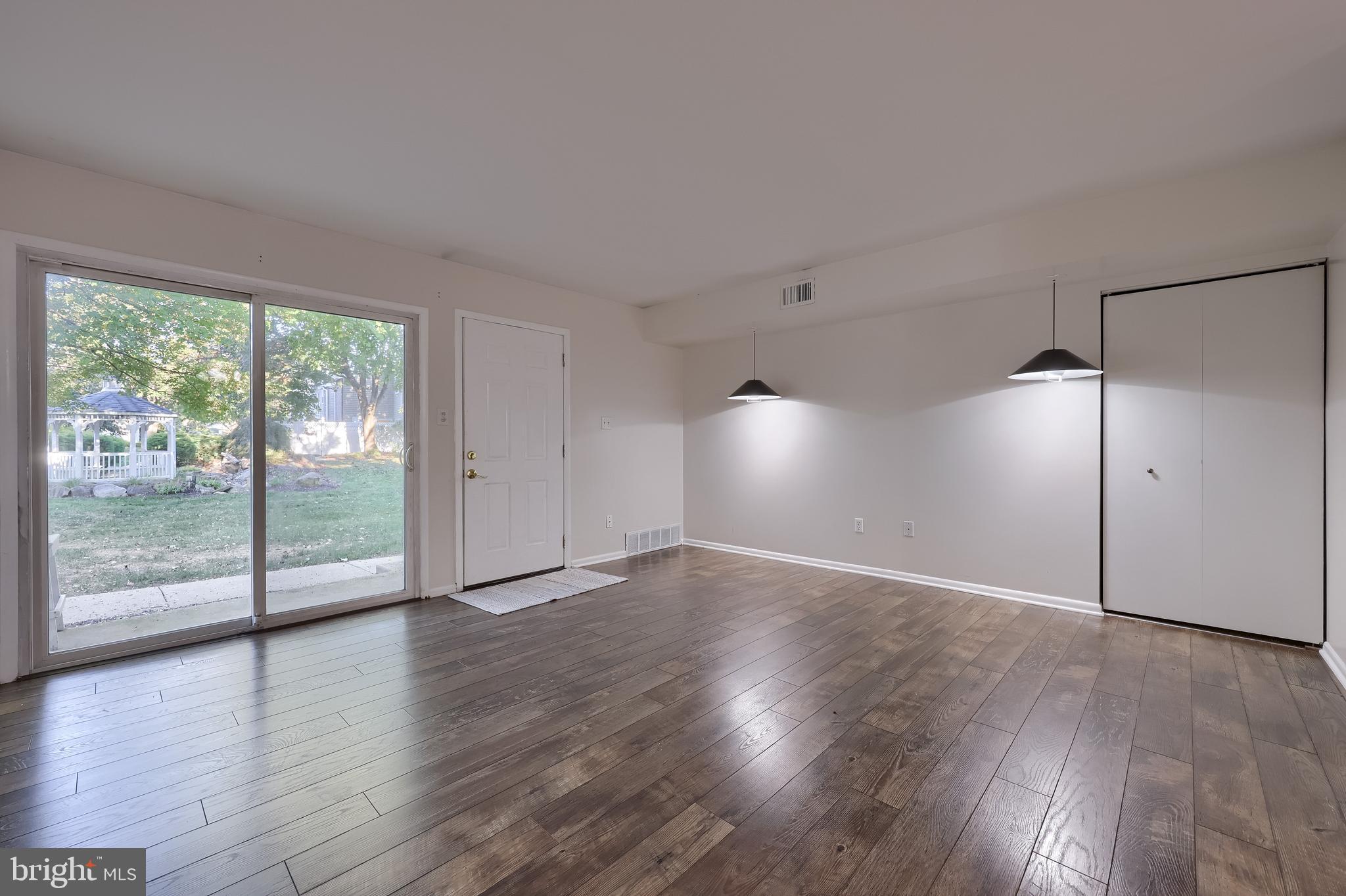 2900 State Hill Road, Unit I5 Reading, PA 19610 - Photo 5 of 26 an empty room with wooden floor and windows