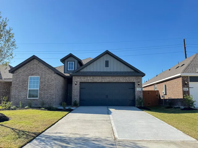 a front view of a house with garage