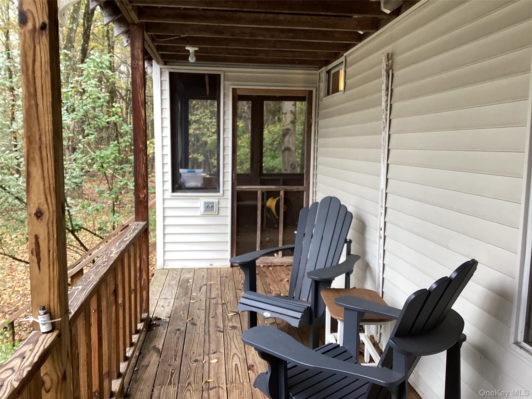 302 Todd Road, Unit T Woodbourne, NY 12788 - Photo 5 of 14 a view of balcony with wooden floor and outdoor seating