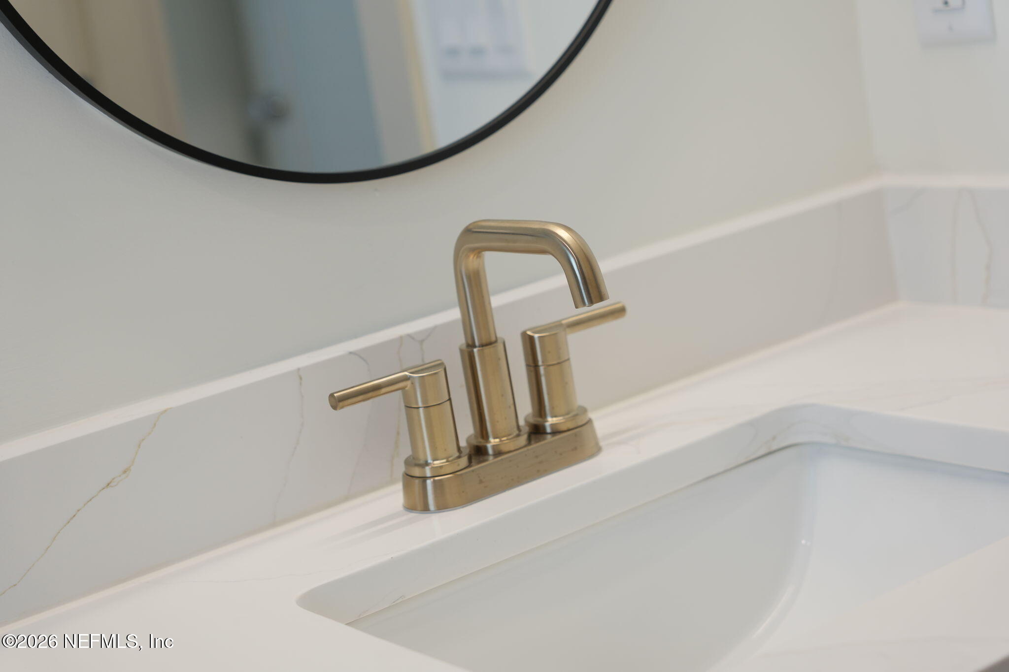 716 West 6th Street St. Augustine, FL 32084 - Photo 22 of 28 a close view of a faucet in a bathtub