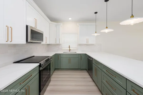 a kitchen with a sink and cabinets