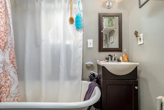 a bathroom with a sink and mirror