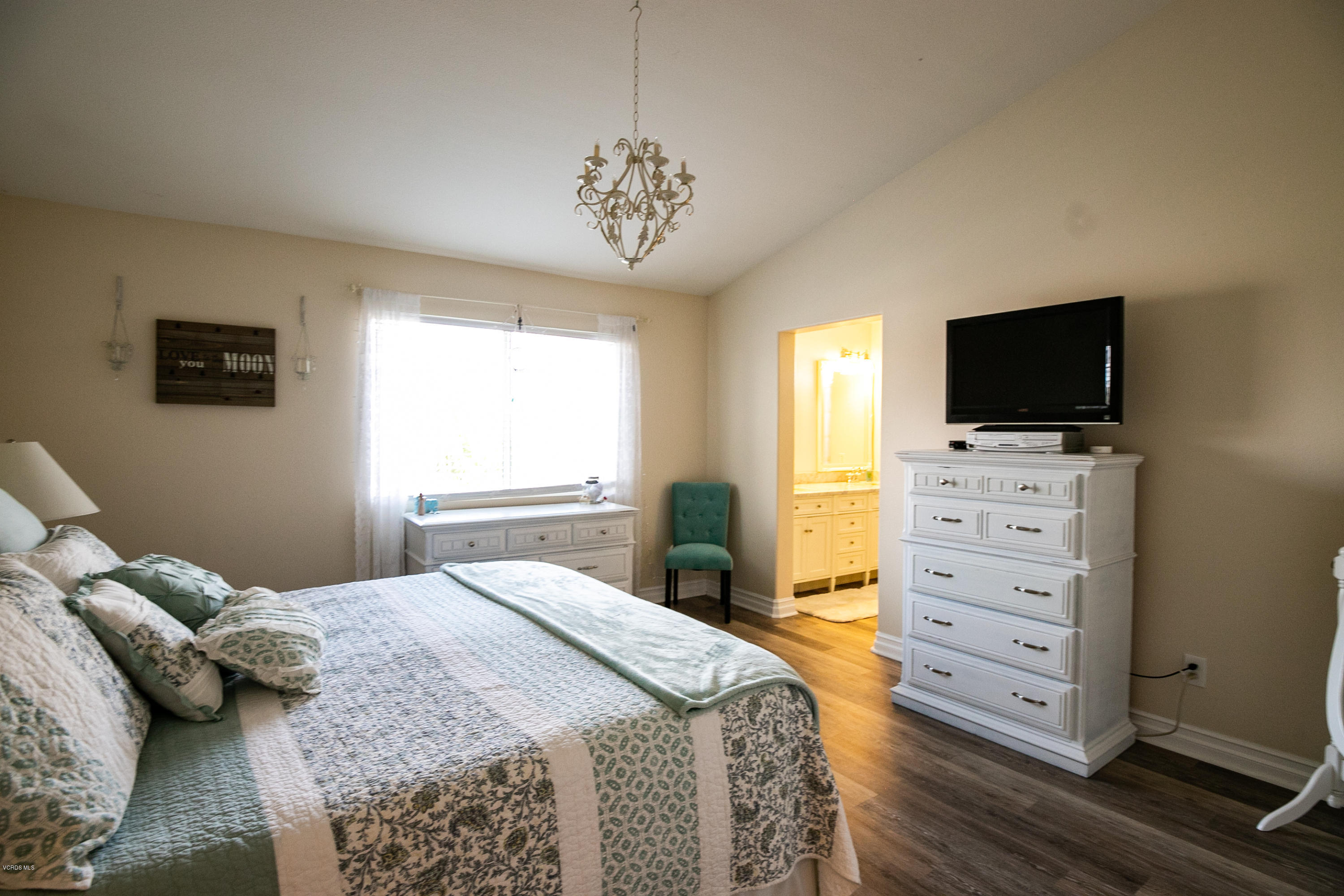 702 Perth Place Oxnard, CA 93035 - Photo 22 of 36 a bedroom with a bed and a flat tv screen on dresser