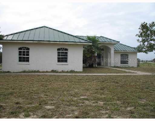 6 Blue Jordan Road Frostproof, FL 33843 - Photo 1 of 1 a house with yard in front of it