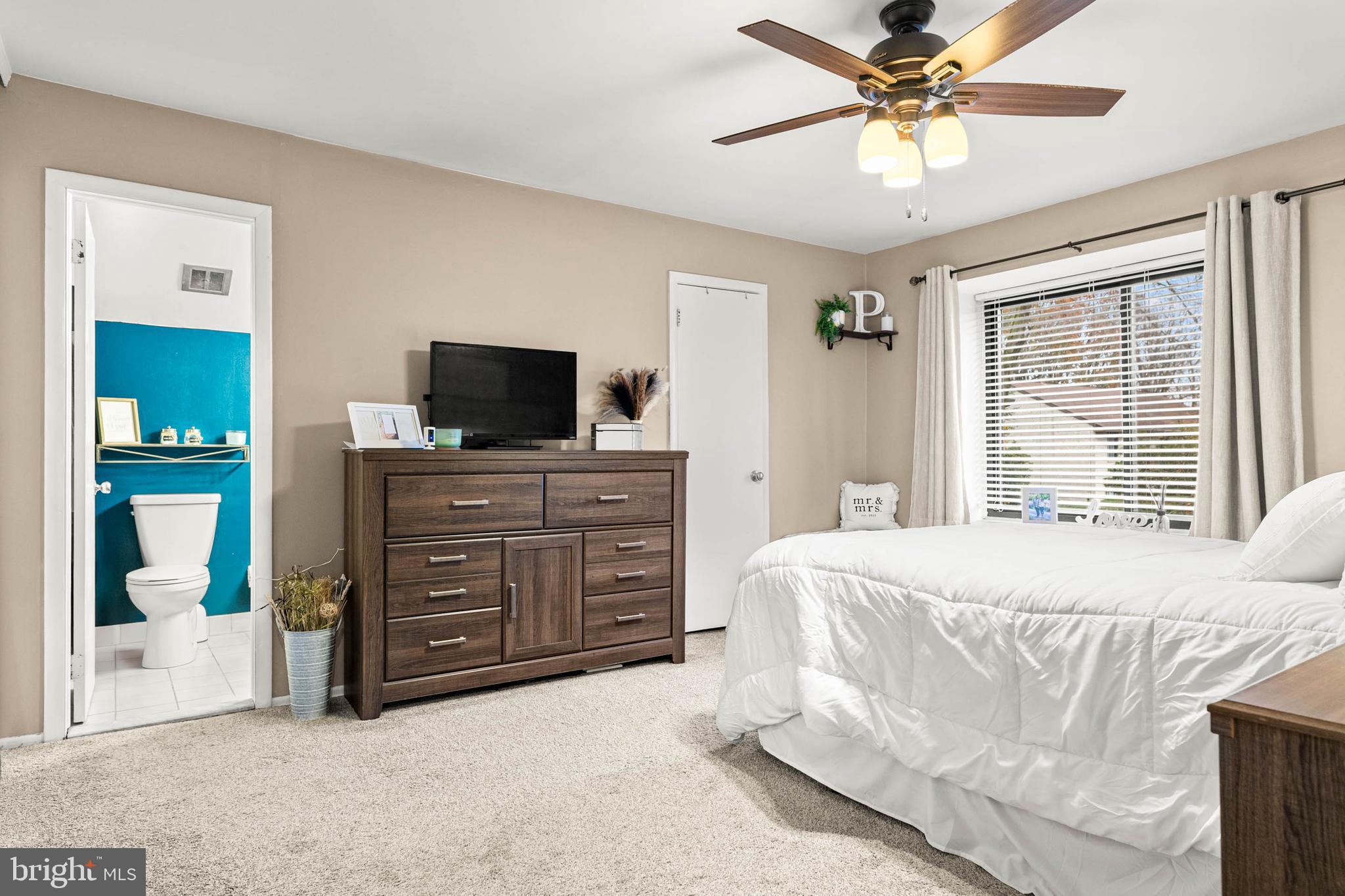 2201 Aspen Circle Springfield, PA 19064 - Photo 11 of 18 a spacious bedroom with a bed and a television