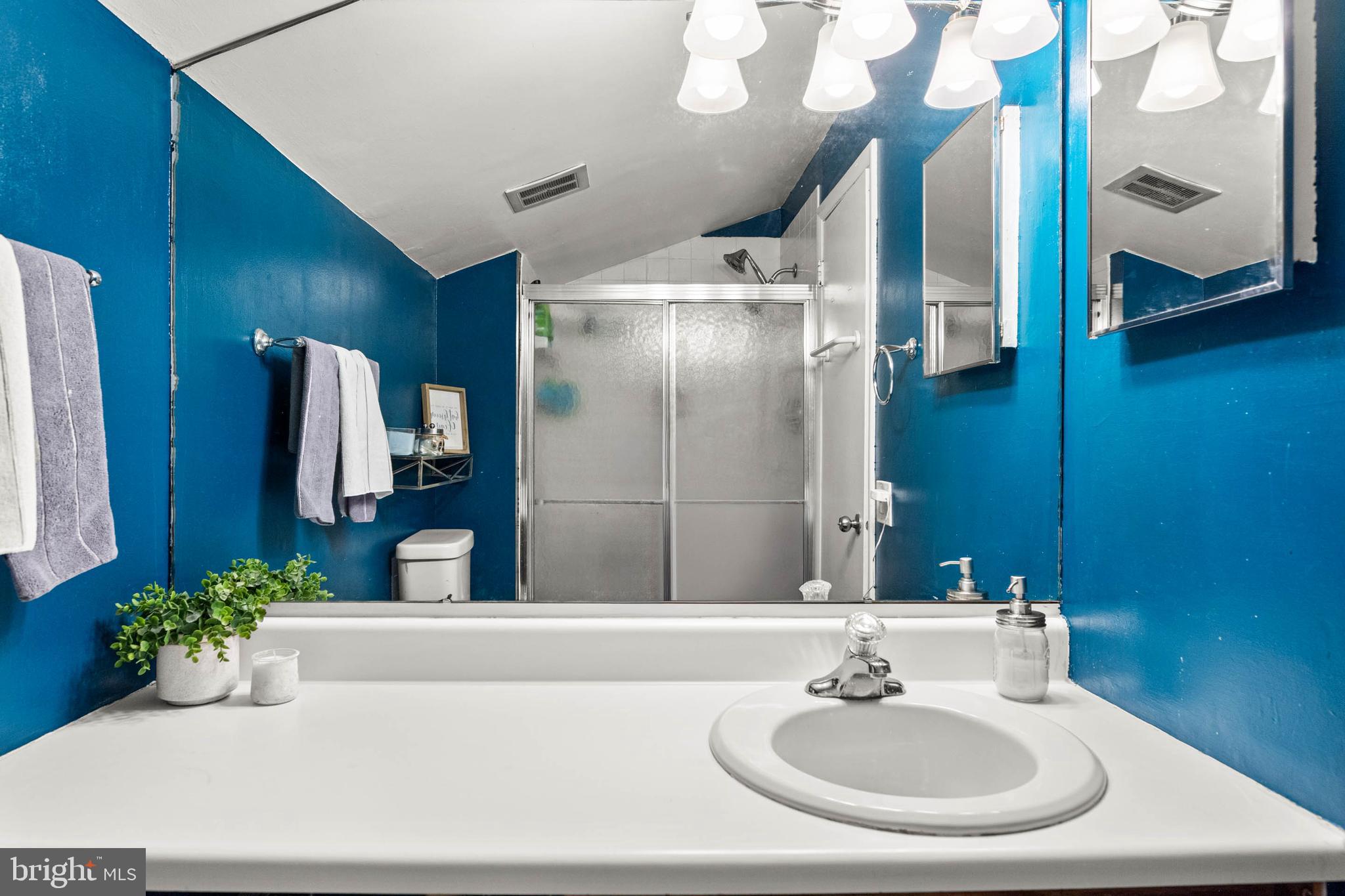 2201 Aspen Circle Springfield, PA 19064 - Photo 12 of 18 a bathroom with a sink and a mirror