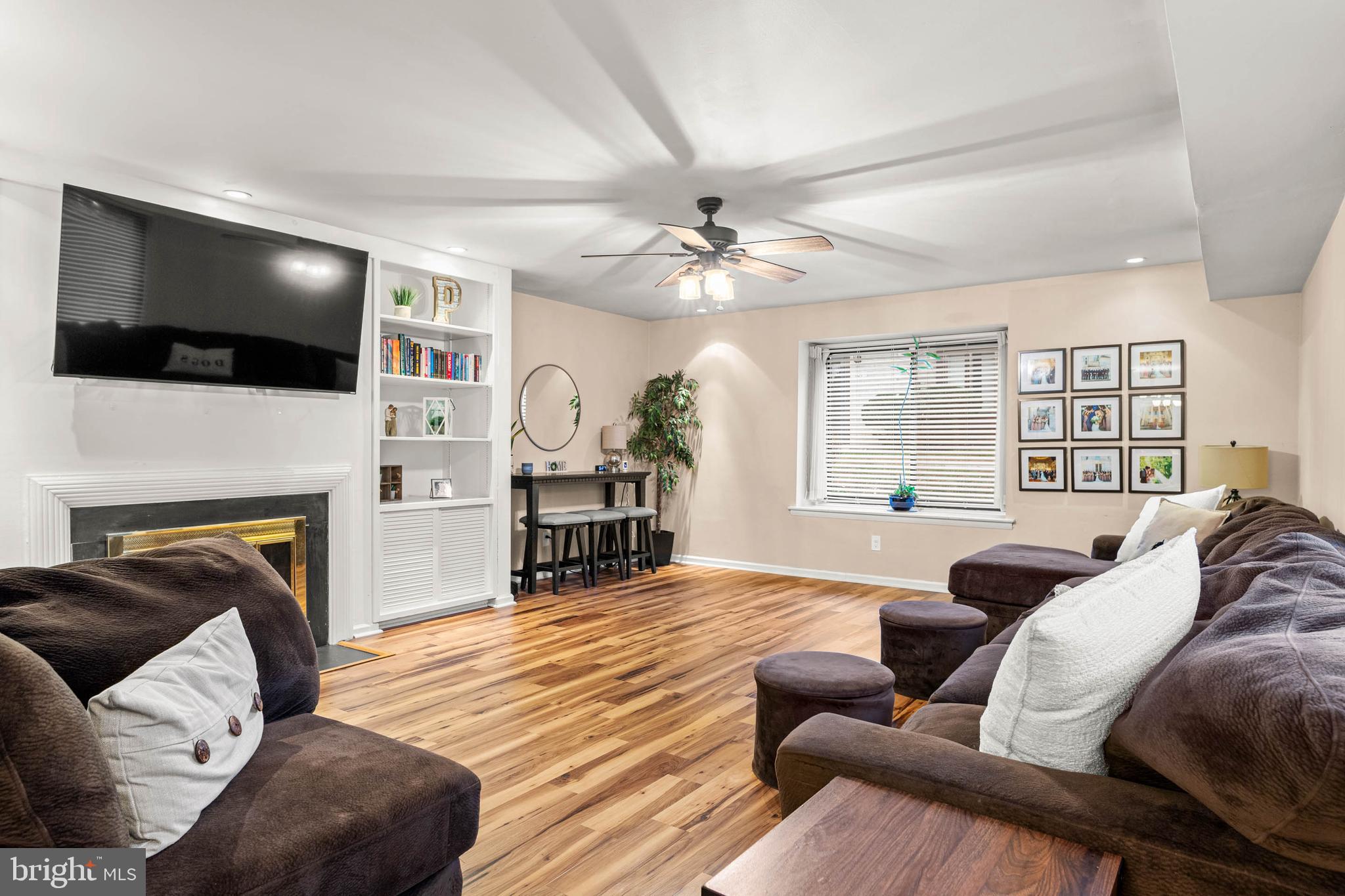 2201 Aspen Circle Springfield, PA 19064 - Photo 2 of 18 a living room with furniture fireplace and flat screen tv