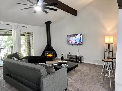 a bedroom with a bed and lamps