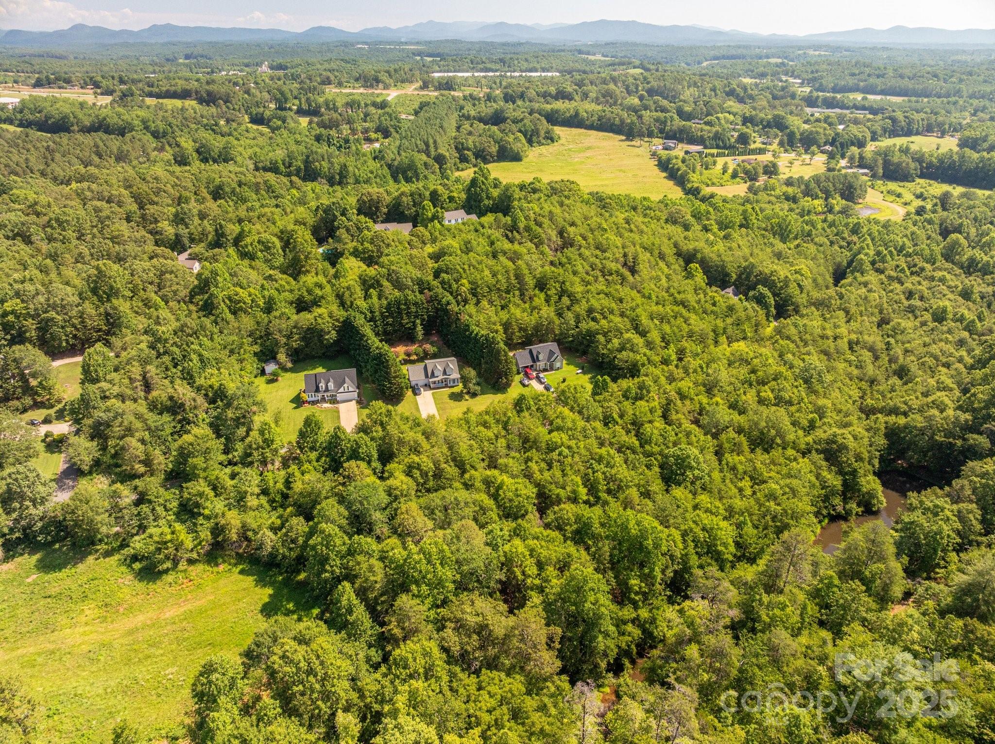 Lot 7 Meadow Crossing Drive Rutherfordton, NC 28139 - Photo 9 of 15 an aerial view of residential houses with outdoor space and mountain view