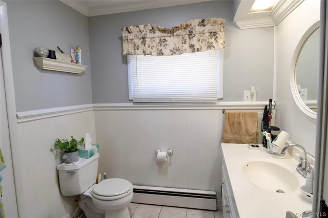 a bathroom with a sink a mirror and a toilet