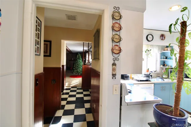 a kitchen with a refrigerator and a stove top oven
