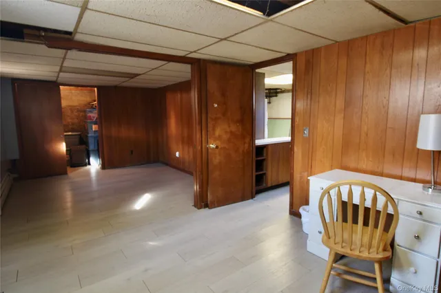 a view of an entryway with wooden floor