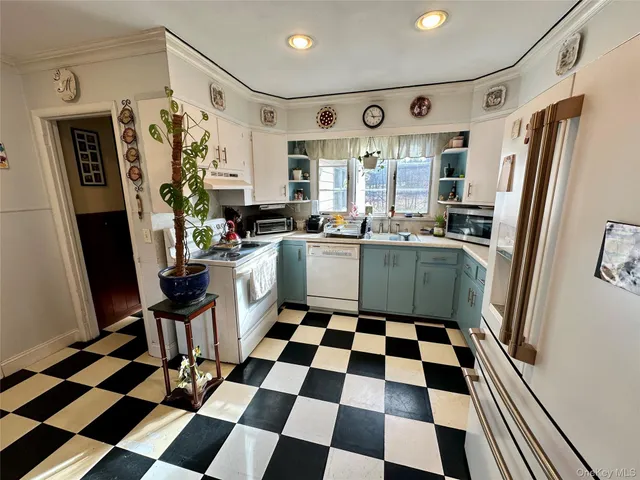 a kitchen with a checkered floor and a black white checkered kitchen