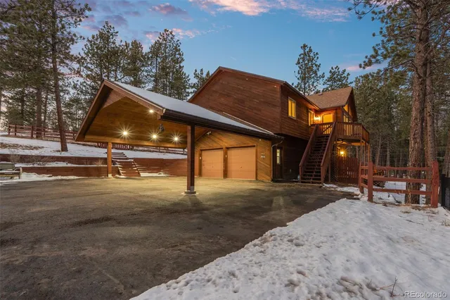 a view of a street with tall trees