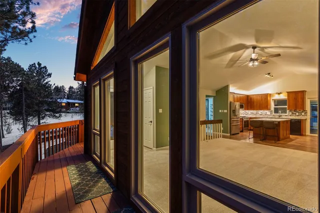 a view of a balcony with dining area