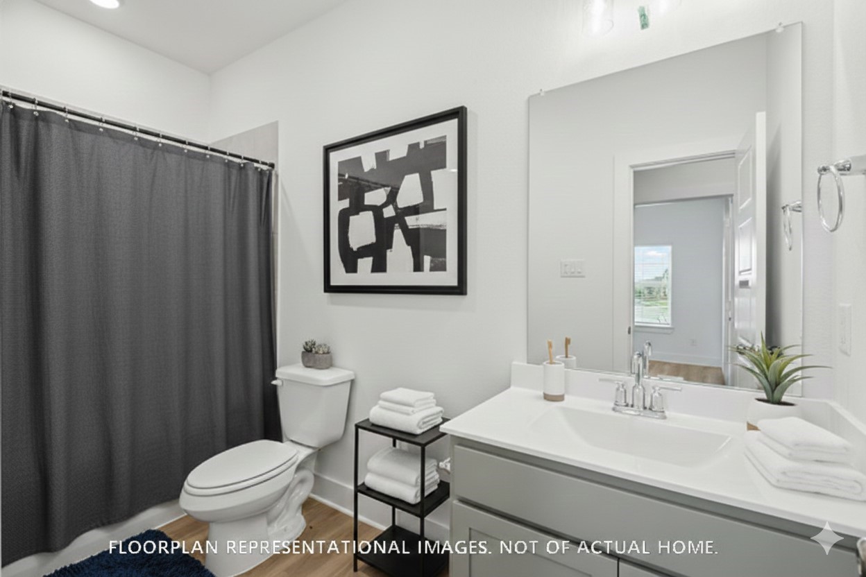 2127 Lone Bronco Boulevard Rosenberg, TX 77471 - Photo 14 of 16 a bathroom with a toilet a sink and a mirror