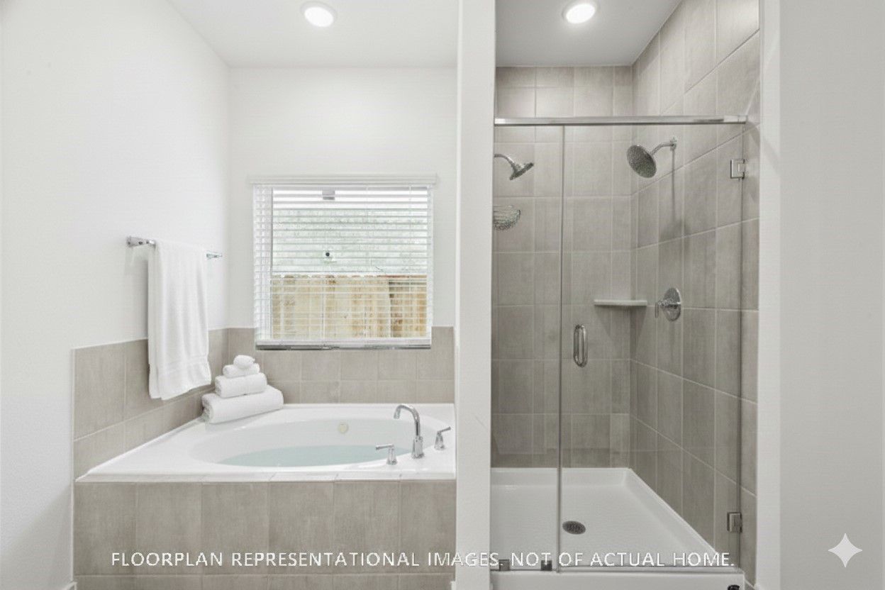 2127 Lone Bronco Boulevard Rosenberg, TX 77471 - Photo 10 of 16 a bathroom with a bathtub a shower and a sink