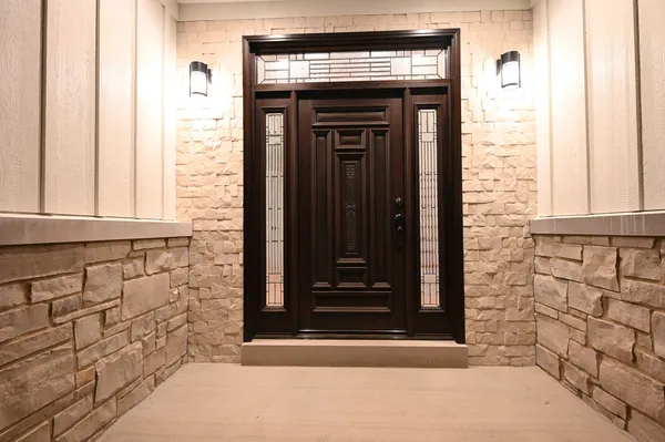 a large kitchen with stainless steel appliances kitchen island granite countertop a refrigerator a stove a sink dishwasher and white cabinets with wooden floor