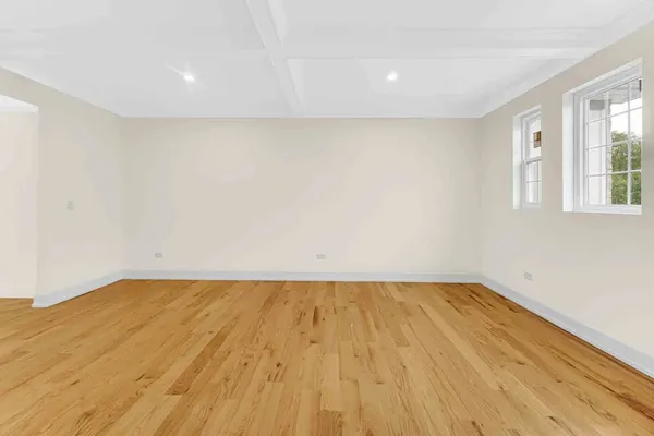 a bedroom with a bed and a night stand