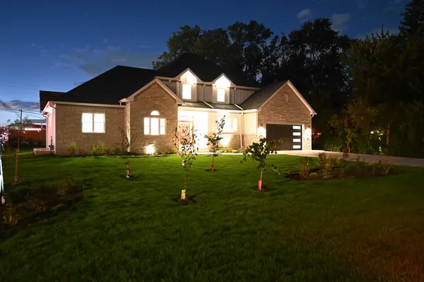 a front view of a house with a yard