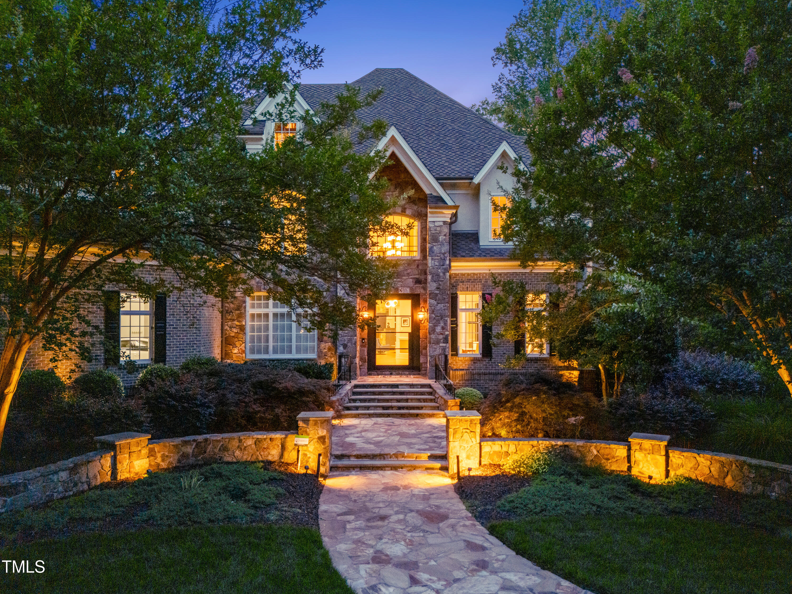 11205 Jonas Ridge Lane Raleigh, NC 27613 - Photo 2 of 3 a front view of a house with a yard
