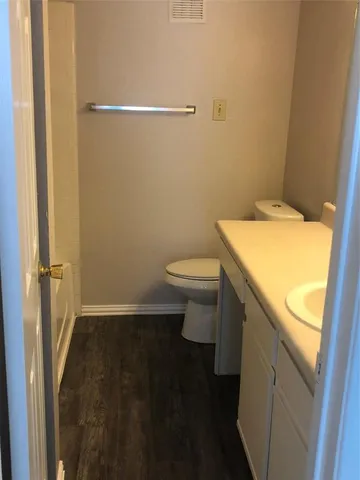 a bathroom with a sink and toilet
