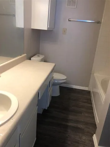 a bathroom with a sink and toilet