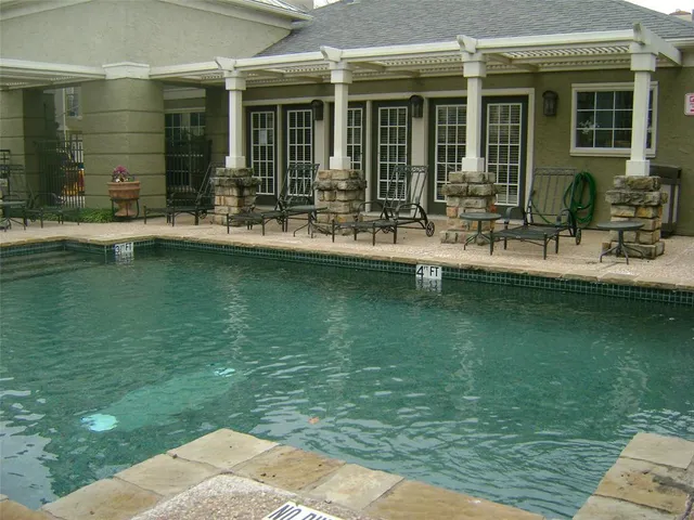 a front view of a house with swimming pool